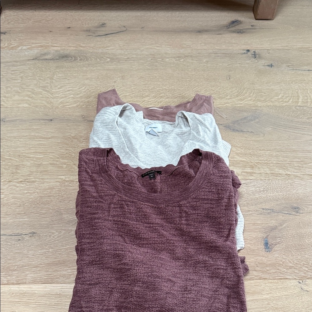 Stack of Burgundy and Gray Sweaters